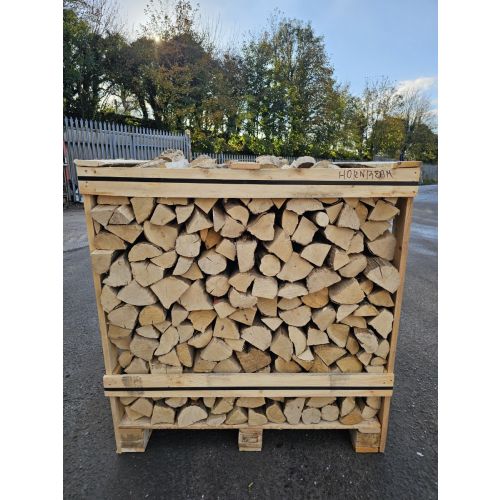 Kiln dried hornbeam firewood cut to 25cm and packed in a large crate for efficient, long-lasting heat