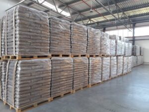 Hardwood heating pellets loaded on pallets for bulk trailer delivery and large-scale heating use