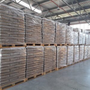 Hardwood heating pellets loaded on pallets for bulk trailer delivery and large-scale heating use
